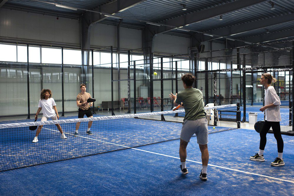 people-playing-padle-tennis-inside